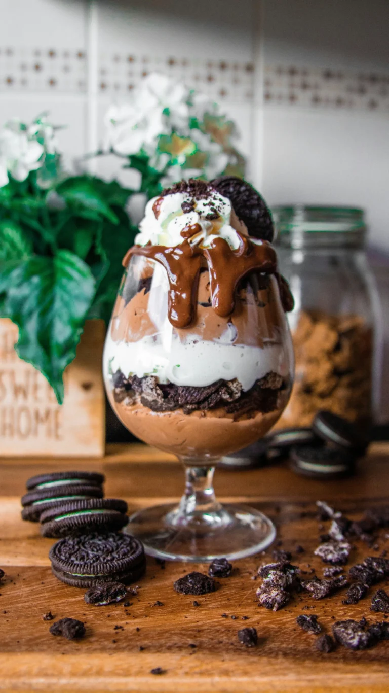 A bowl of creamy vegan banana ice cream topped with almonds, marshmallows, and chocolate chips—guilt-free Rocky Road Nice Cream recipe.